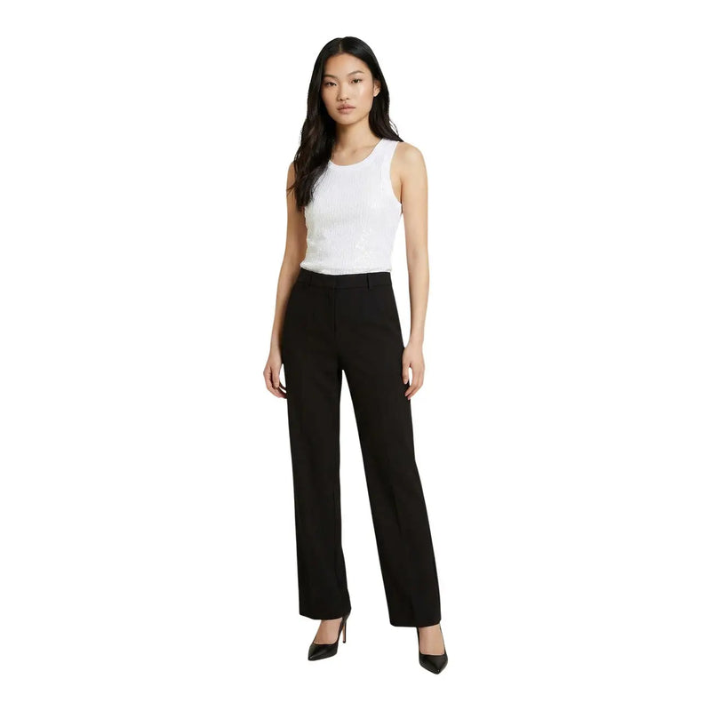 Black wide-leg trousers with sleek tailored fit paired with guess women white cotton sleeveless tank top