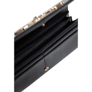 Black Guess women wallet in polyurethane with button closure black leather clutch and gold-tone hardware zipper interior