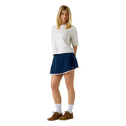 Guess women navy blue pleated tennis skirt with white trim and black logo paired with white cotton rhinestone t shirt