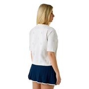 Guess women white cotton rhinestone Silvy t shirt with subtle light gray leaf embroidery and navy pleated skirt