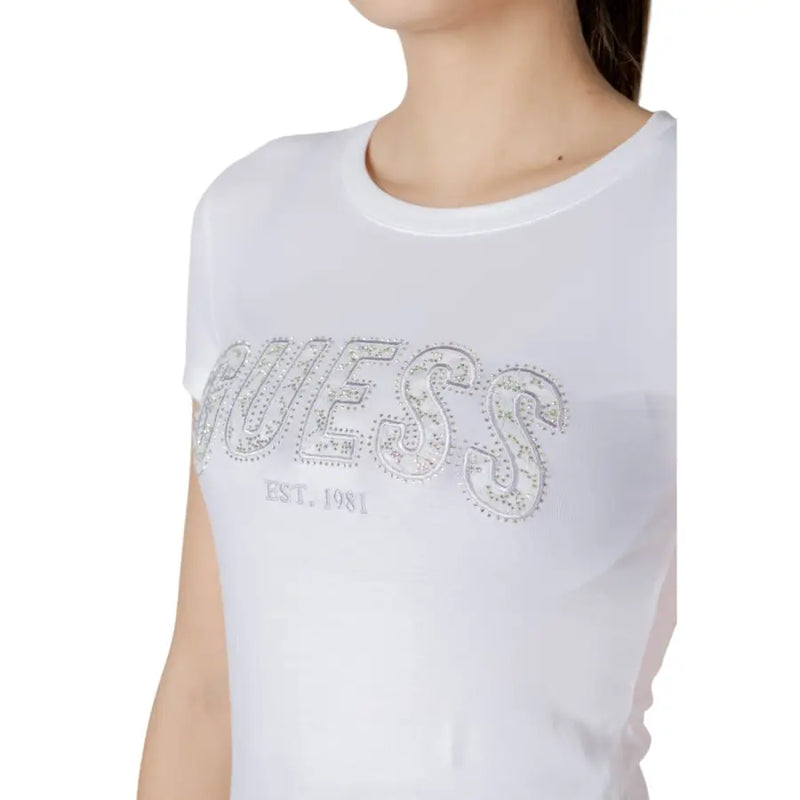 White cotton short sleeve t-shirt by Guess featuring a sparkling silver rhinestone-embellished Guess logo est