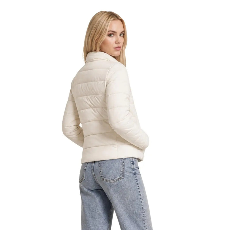 Cream-colored quilted puffer jacket with high collar and long sleeves made of polyester by Guess Women