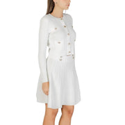 Women wearing Guess Women White Long Buttoned Round Neck Cardigan and pleated mini skirt set