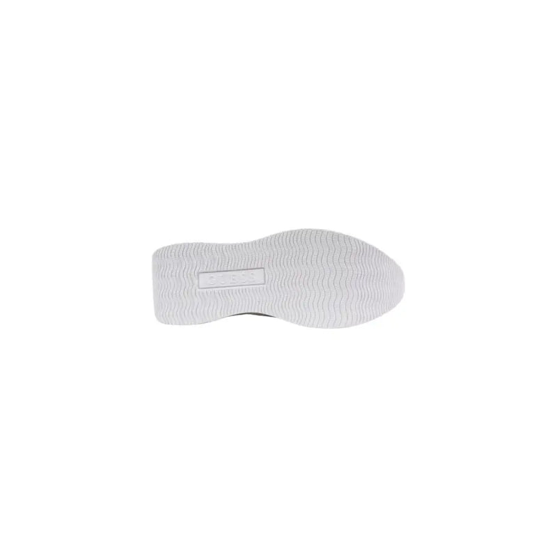 Back side of white rubber sole with textured wavy pattern and Guess embossed label on women platform sneakers spring summer collection