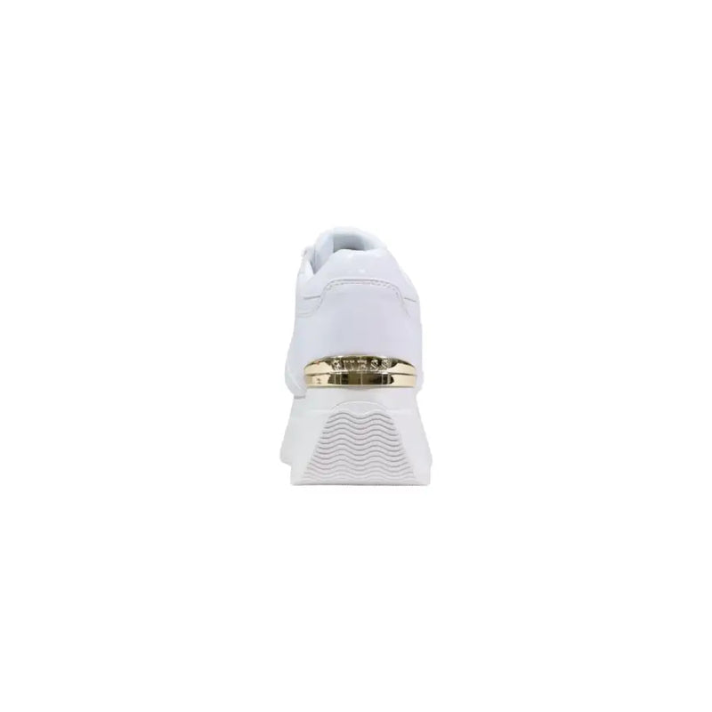 White Guess women platform sneaker featuring gold-tone metallic accent band and textured wave-patterned sole