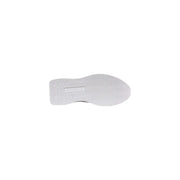 Back side of white rubber sole with textured wavy pattern and Guess embossed label on women platform sneakers spring summer collection