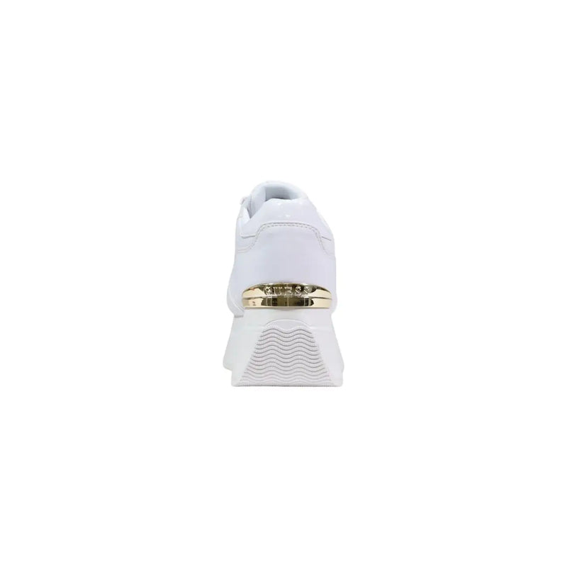 White Guess women platform sneaker featuring gold-tone metallic accent band and textured wave-patterned sole