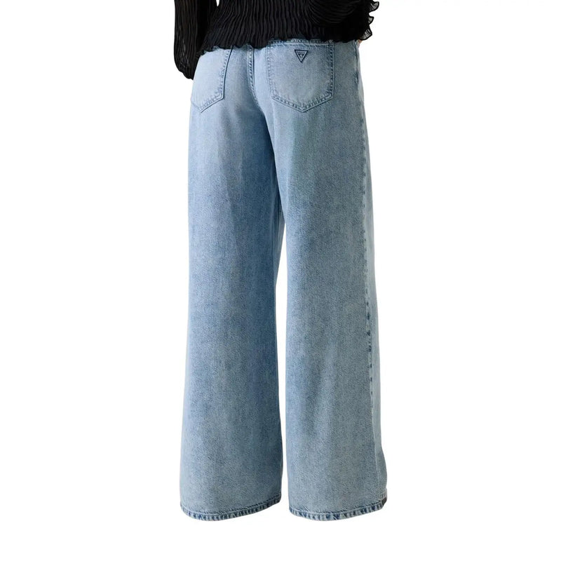 Back view of guess women wide loose lyocell blend jeans in light-wash denim with faded texture and small logo on pocket