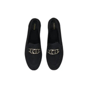 Guess women’s black leather moccasin flats featuring black suede loafers with a silver-toned g logo buckle