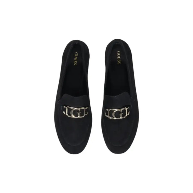 Guess women’s black leather moccasin flats featuring black suede loafers with a silver-toned g logo buckle