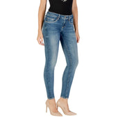 Guess women’s blue denim skinny jeans with faded wash and classic five-pocket design featuring worn-out effect