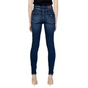 Dark blue denim guess womens jeans with fitted cut subtle fading and logo on the back pocket shown from the back side