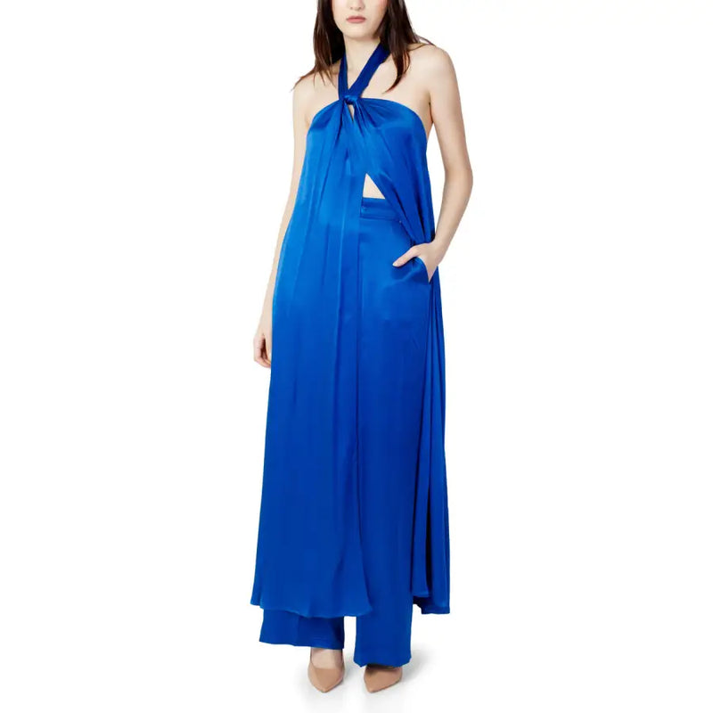 Woman in royal blue satin halter-neck top and wide-leg pants from Hanny Deep Jumpsuit