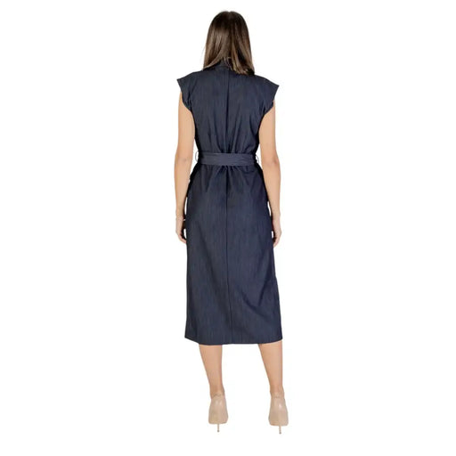 A navy blue sleeveless midi dress by Ichi with subtle pinstripes and a matching belt for fall and winter wear