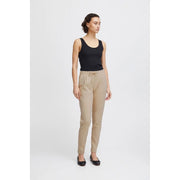 Beige ichi women trousers with lace front pockets and drawstring waistband featuring relaxed fit and tapered legs