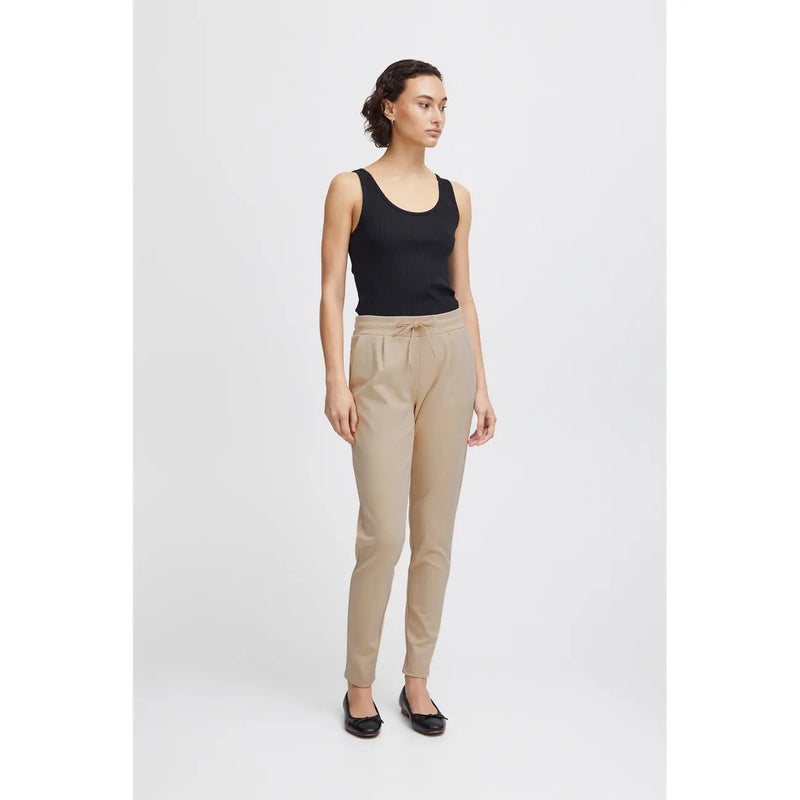 Beige ichi women trousers with lace front pockets and drawstring waistband featuring relaxed fit and tapered legs