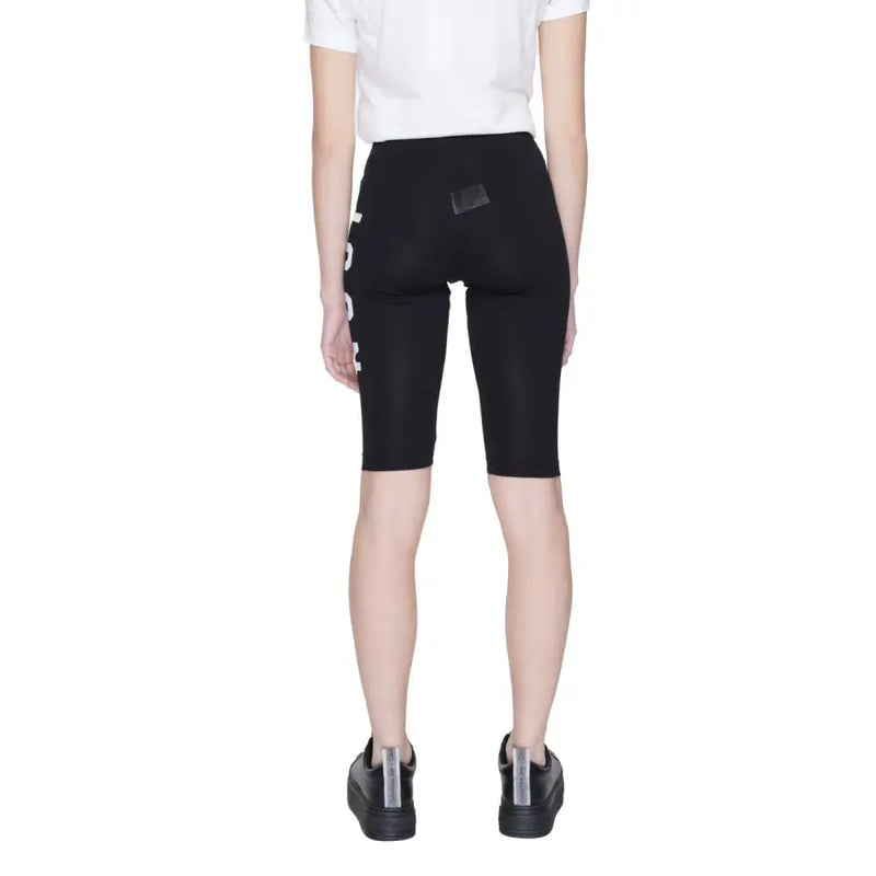 Icon men black cotton slip-on shorts featuring high-waisted black bike shorts with white vertical lettering and rear patch