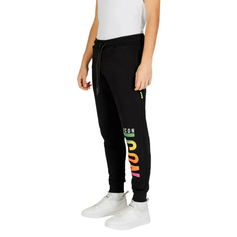 Icon men black laced printed trousers for fall winter featuring vertical rainbow icon logo and neon green zipper pull