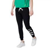 Black jogger pants with white drawstring and icon lettering on leg made of cotton blend for casual wear