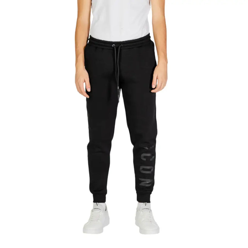 Black jogger pants with a subtle gray icon logo down the left leg from icon men trousers collection