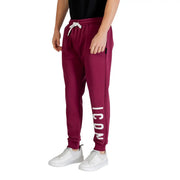 Maroon icon men trousers with white drawstring and vertical icon lettering on the leg in jogger style