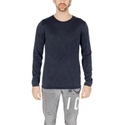 Dark navy long-sleeved cotton knit pullover with subtle texture and brand tag at hem by Jack and Jones for men