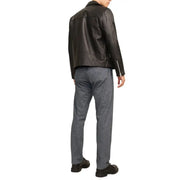 Black leather biker jacket with sleeve and back zippers shown from the back paired with jack and jones grey cotton stretch trousers for men fall winter