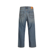Blue denim jeans with a relaxed fit and orange patch on the back pocket.