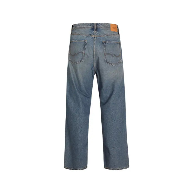 Blue denim jeans with a relaxed fit and orange patch on the back pocket.