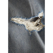 Distressed denim jeans with a tear in the knee area, featuring light blue wash and frayed edges.