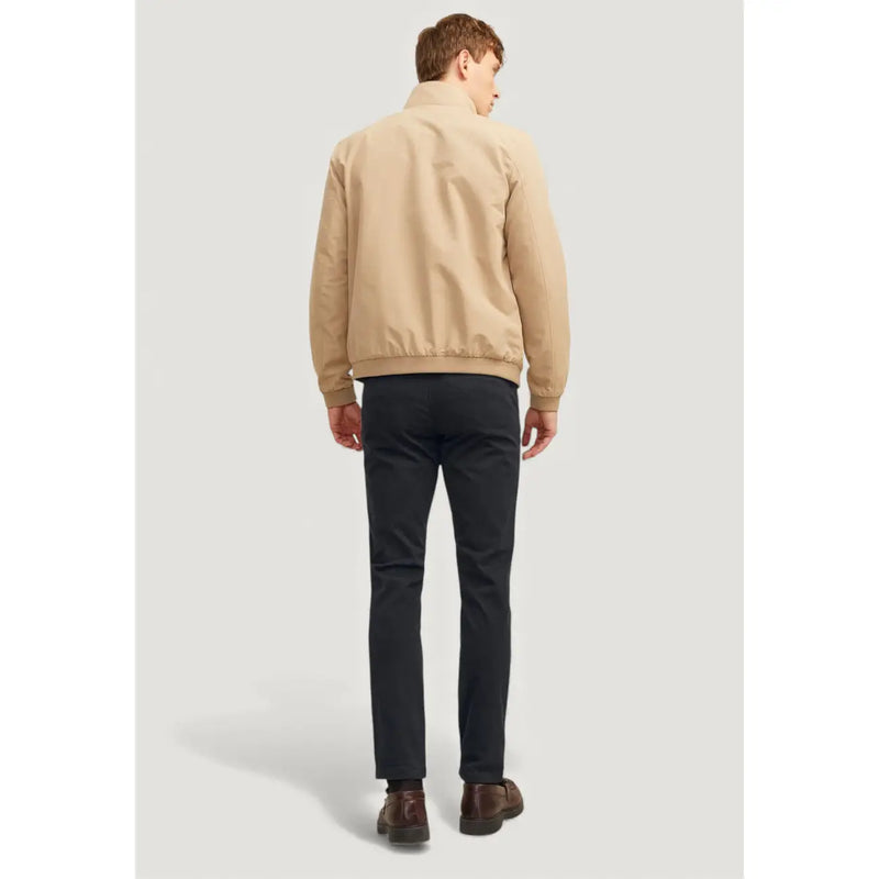 Beige bomber jacket with classic collar and ribbed cuffs paired with jack and jones men cotton black trousers
