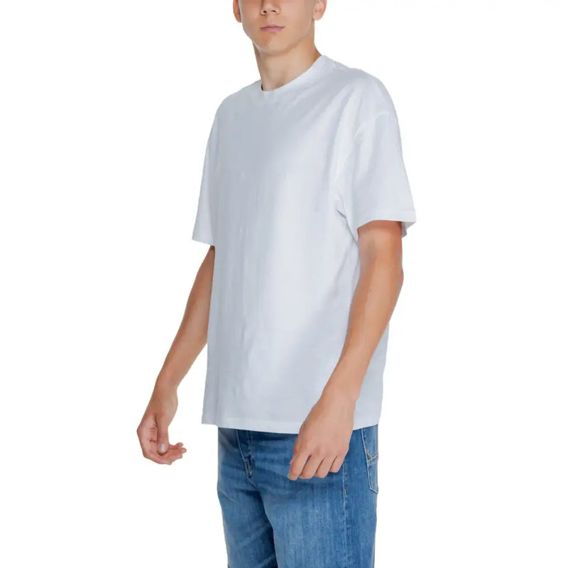 Young man wearing Jack & Jones white short sleeve round neck t-shirt and blue jeans
