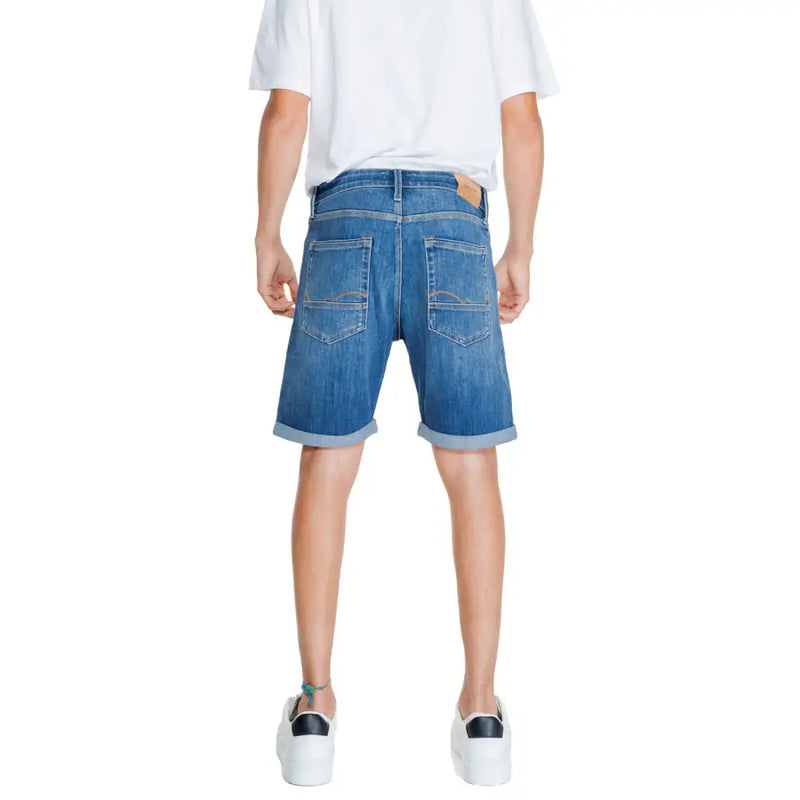 Jack & jones men’s blue denim shorts with rolled cuffs and classic back pocket design shown from the back side