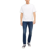 White crew-neck cotton t-shirt paired with jack & jones men’s blue worn-out effect dark wash denim jeans