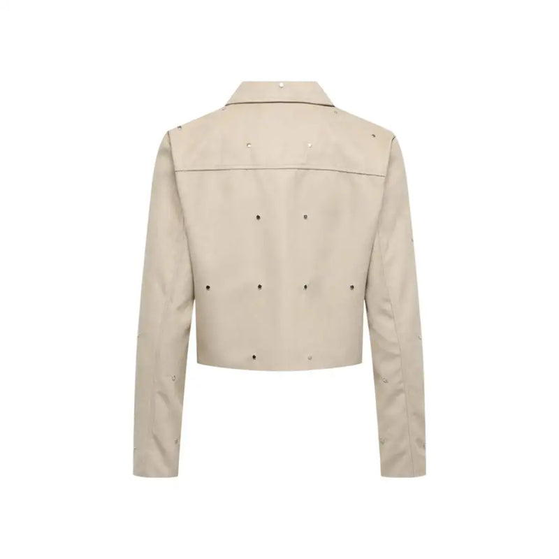 Beige cropped leather jacket with silver studs on shoulders back and sleeves for a stylish edgy look