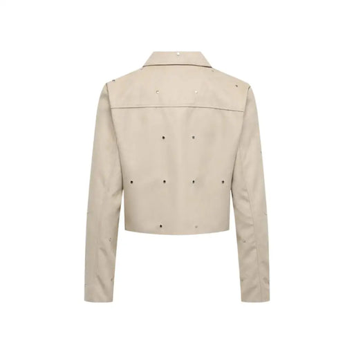 Beige cropped leather jacket with silver studs on shoulders back and sleeves for a stylish edgy look