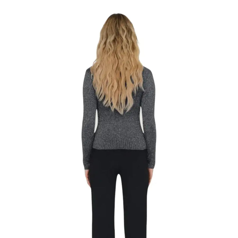 Woman with long wavy blonde hair wearing Jacqueline De Yong Blue Viscose Blend Long Round Neck Knitwear