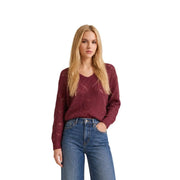 A maroon knitted sweater with a v-neck and intricate cable knit pattern from Jacqueline De Yong women blue glitter knit collection