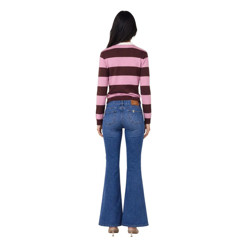 Blue denim flare jeans with classic five-pocket design and brown leather brand patch on back waistband shown from back