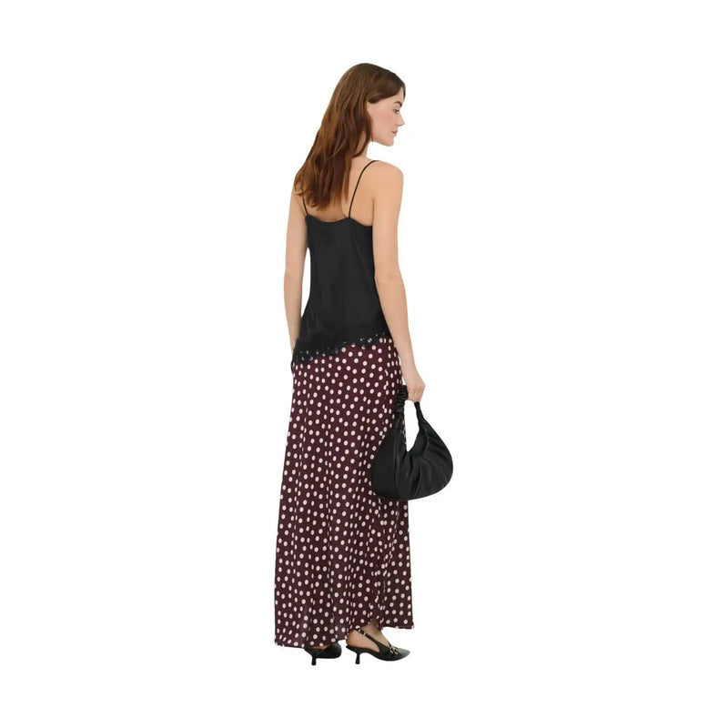 Black leather hobo bag with soft slouchy silhouette and single shoulder strap shown alongside jacqueline de yong women tank top asym lace black polyester s l