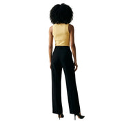 Black high-waisted wide-leg trousers with a sleek tailored fit paired with jacqueline de yong yellow tank top v neck buttons