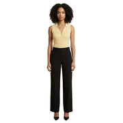 A sleek black wide-leg trouser with tailored fit and subtle creases paired with jacqueline de yong yellow v neck tank top