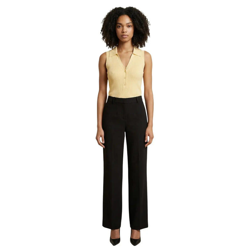 A sleek black wide-leg trouser with tailored fit and subtle creases paired with jacqueline de yong yellow v neck tank top