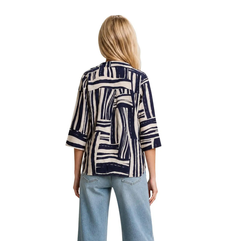 A woman wears a jacqueline de yong blue v neck top with three quarter sleeves in viscose fabric featuring navy and cream stripes