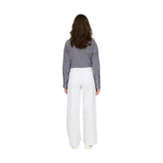 A woman wears jacqueline de yong women white cotton high-waisted wide-leg trousers size 30 with a navy striped shirt