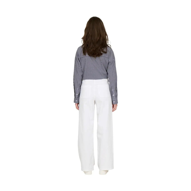 A woman wears jacqueline de yong women white cotton high-waisted wide-leg trousers size 30 with a navy striped shirt