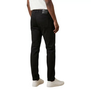 Black slim-fit chinos by Jeckerson featuring sleek tailored design and subtle stitching details for men