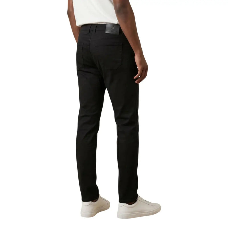 Black slim-fit chinos by Jeckerson featuring sleek tailored design and subtle stitching details for men