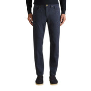 Dark blue denim jeans with straight-leg cut and gold-tone button complement beige cotton blend pique trousers