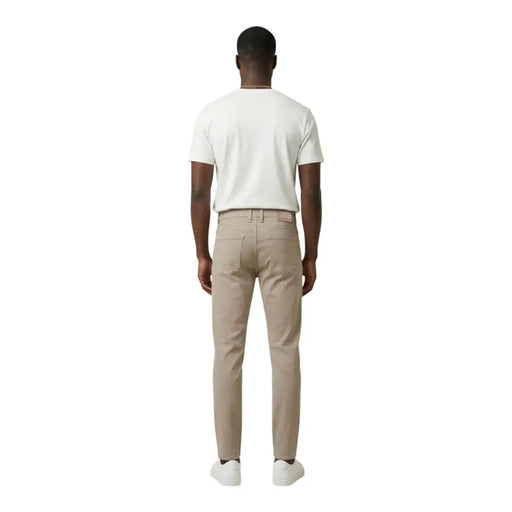 Beige slim fit chino trousers by jeckerson in a cotton blend pique fabric with subtle stitching details
